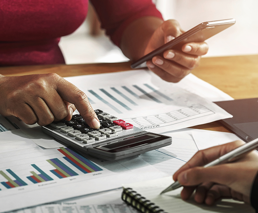 business woman working with calculator in office
